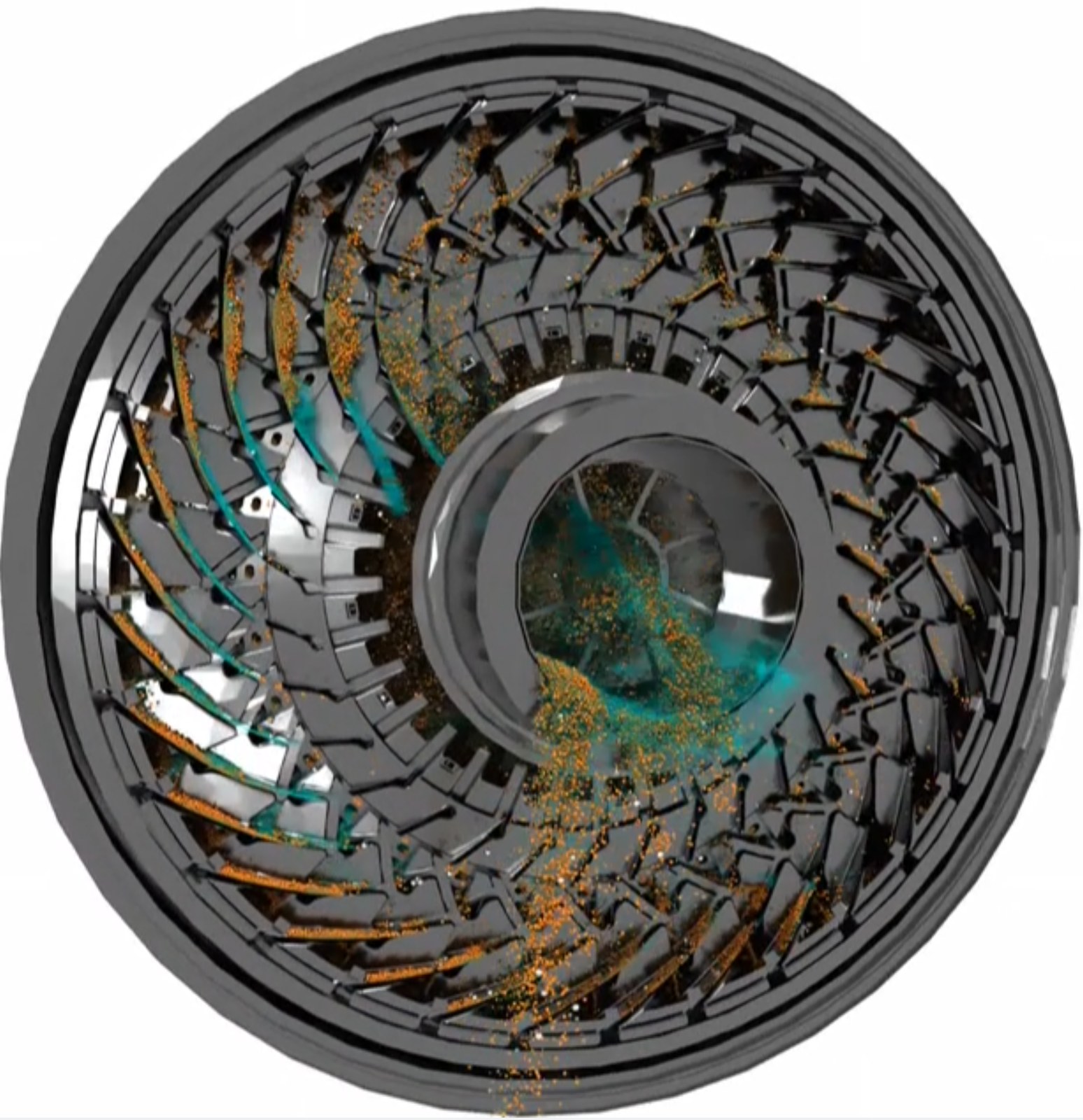 Full scale SAG mill seen end-on through the pulp lifters, ore and slurry discharging